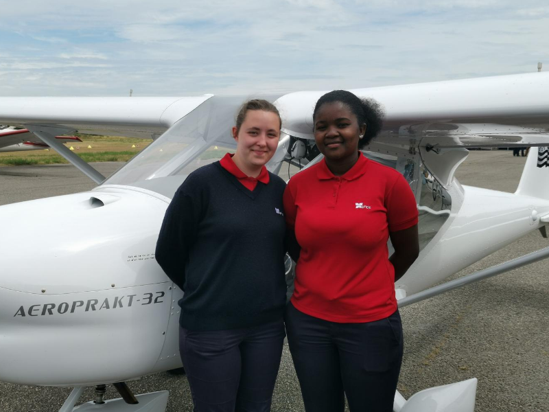 Two young EPIDE women before their flight